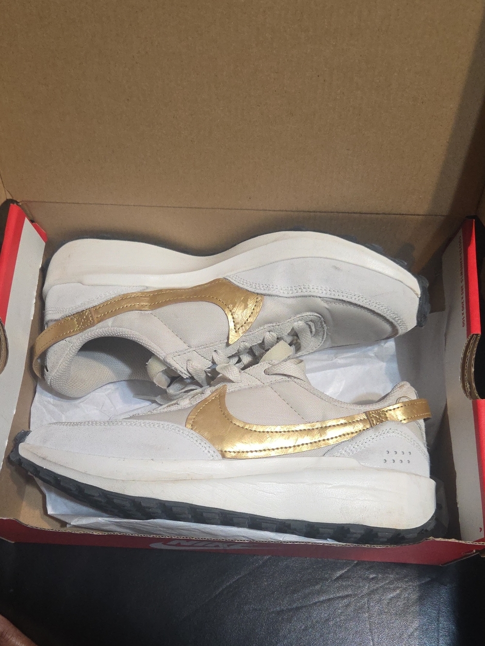 Nike Women’s White Sneakers with Metallic Gold Swoosh